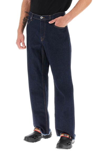 Shop Lanvin Jeans With Frayed Hem Men In Blue