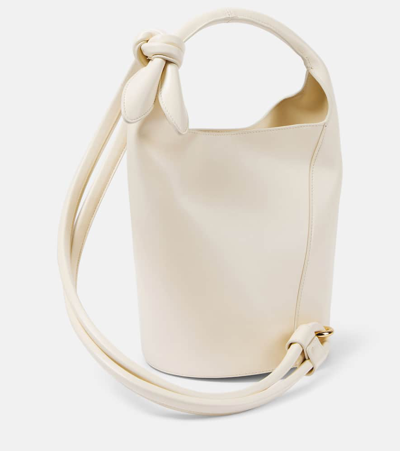 Shop Jacquemus Le Petit Tourni Mini Leather Bucket Bag In Light Ivory