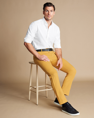 Shop Charles Tyrwhitt Men's  Ultimate Non-iron Chino Pants In Yellow