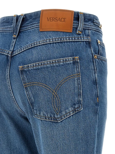 Shop Versace Flared Jeans In Blue