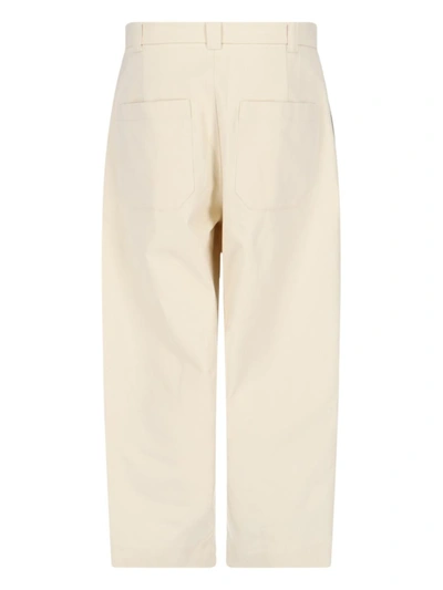 Shop Studio Nicholson Trousers In White