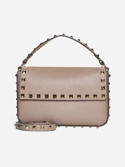 Shop Valentino Rockstud Leather Pouch Bag In Poudre