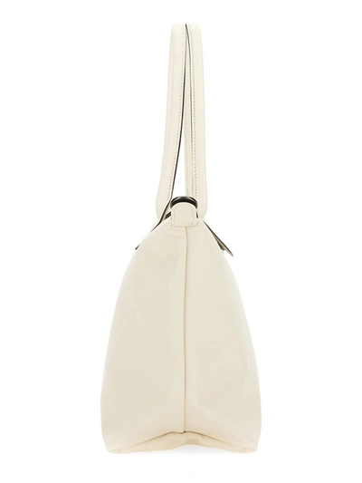 Shop Longchamp "le Pliage" Bag In White