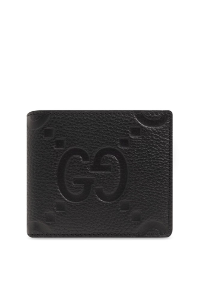 Shop Gucci Logo Embossed Bifold Wallet In Black