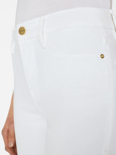 Shop Frame Le High Flare Jeans In White