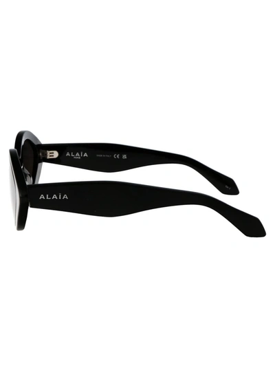 Shop Alaïa Alaia Sunglasses In 001 Black Black Grey