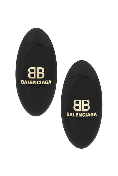 Shop Balenciaga Hairclip Earrings In Black & Gold