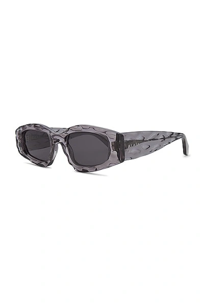 Shop Alaïa Narrow Rectangular Sunglasses In Grey