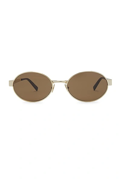 Shop Saint Laurent Round Sunglasses In Gold & Brown