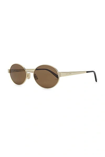 Shop Saint Laurent Round Sunglasses In Gold & Brown