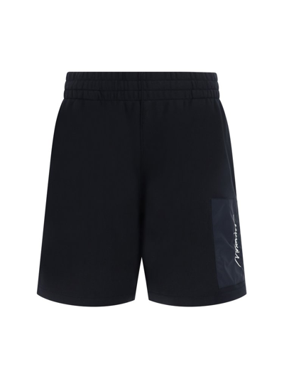Shop Moschino Logo Printed Bermuda Shorts In Black