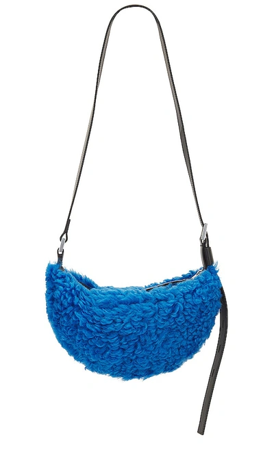 Shop Allsaints Half Moon Shearling Xbody Bag In Sully Blue