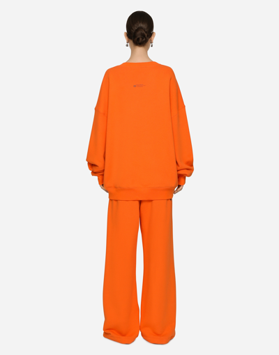 Shop Dolce & Gabbana Jersey Jogging Pants With Dgvib3 Print In Orange