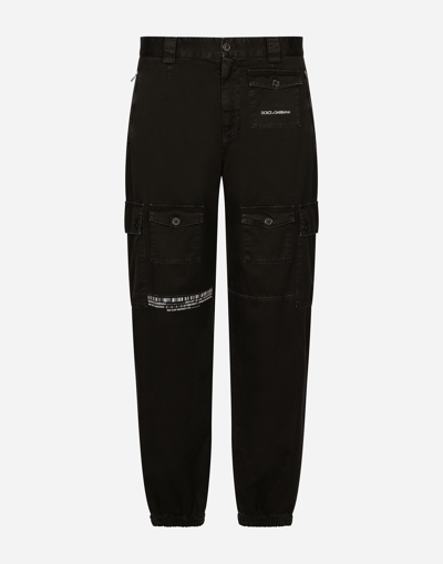 Shop Dolce & Gabbana Garment-dyed Cargo Pants With Multiple Pockets Dgvib3 In Black