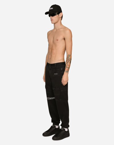 Shop Dolce & Gabbana Garment-dyed Cargo Pants With Multiple Pockets Dgvib3 In Black