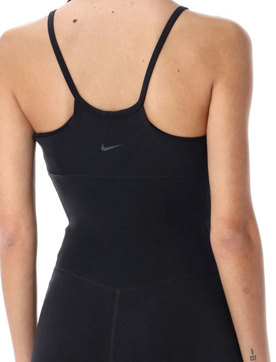 Shop Nike Dri-fit Flared Jumpsuit In Black