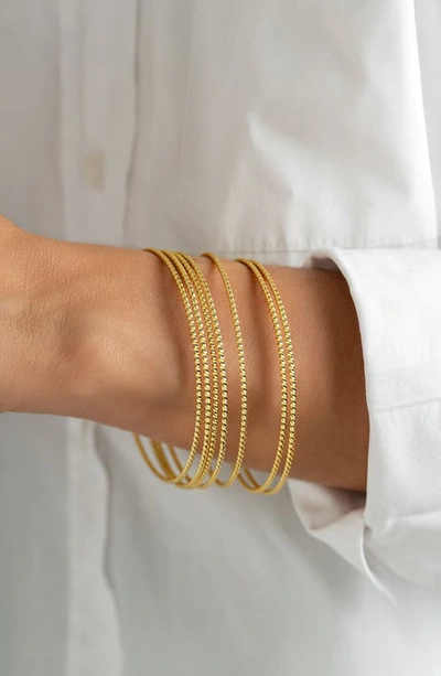 Adornia Set Of 7 Bangle Bracelets In Gold