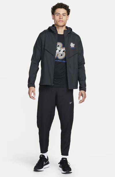 Shop Nike Windrunner Water Repellent Upf 50+ Packable Hooded Jacket In Black/ Black/ Hyper Royal