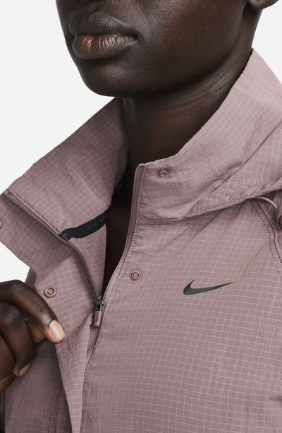 Shop Nike Repel Water Repellent Hooded Jacket In Smokey Mauve/black