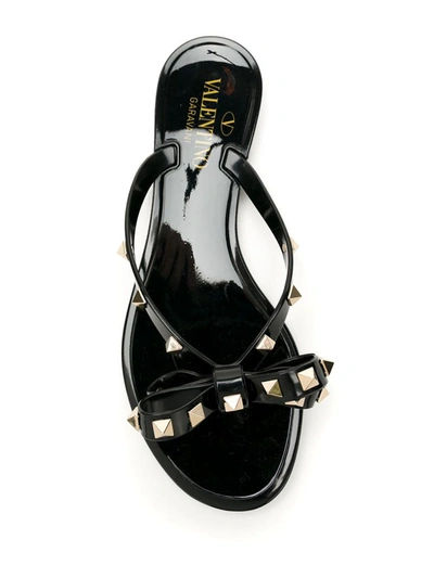 Shop Valentino Garavani Rockstud Rubber Thong Sandals In Black