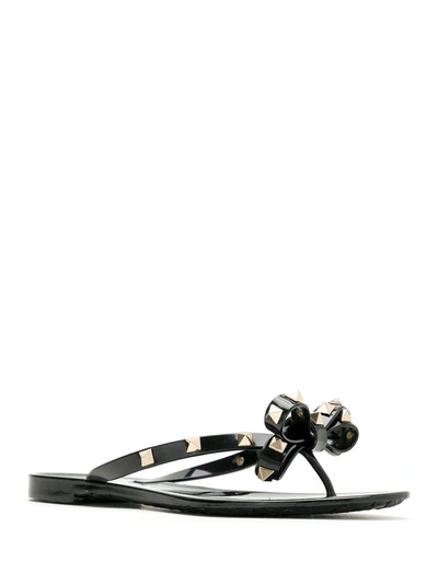 Shop Valentino Garavani Rockstud Rubber Thong Sandals In Black