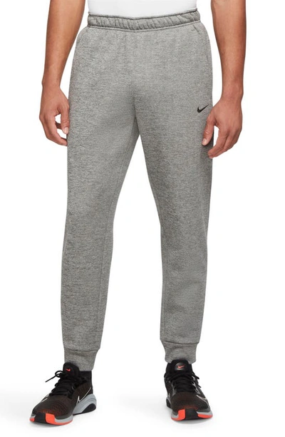 Shop Nike Therma-fit Tapered Training Pants In Dk Grey/ Particle Grey/ Black