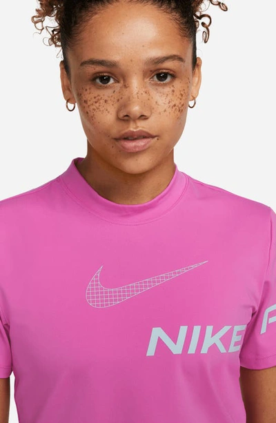 Shop Nike Pro Dri-fit Crop T-shirt In Active Fuchsia/ Ocean Bliss