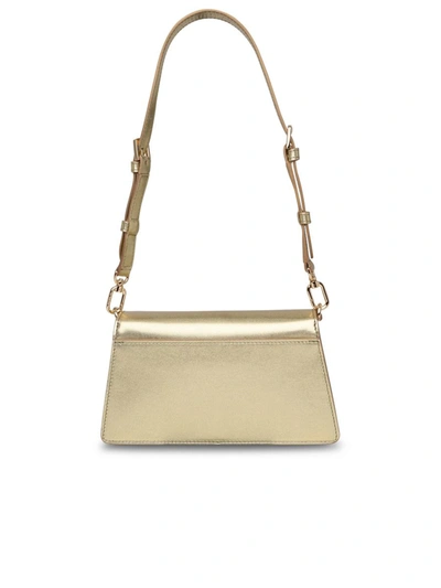 Shop Furla Zoe Mini Crossbody Bag In Gold Leather
