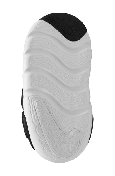 Shop Nike Kids' Dynamo Go 2 Sneaker In Black/ White