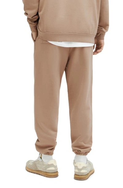 Shop Allsaints Underground Logo Graphic Joggers In Toffee Taupe