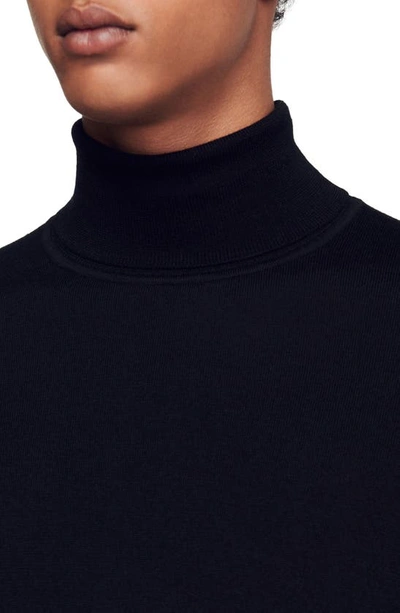 Shop Sandro Wool Turtleneck Sweater In Black