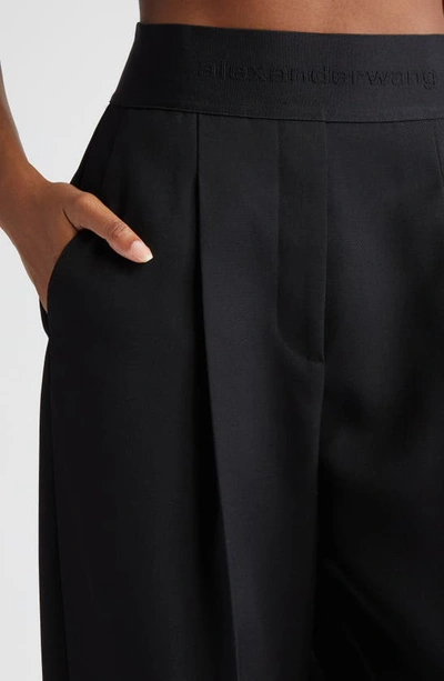 Shop Alexander Wang Pleated Logo High Waist Wool Pants In 001 Black