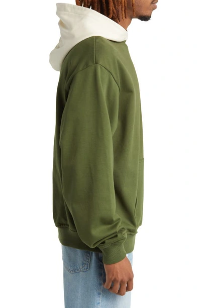 Shop Renowned Collegiate Colorblock Cotton Graphic Hoodie In Green