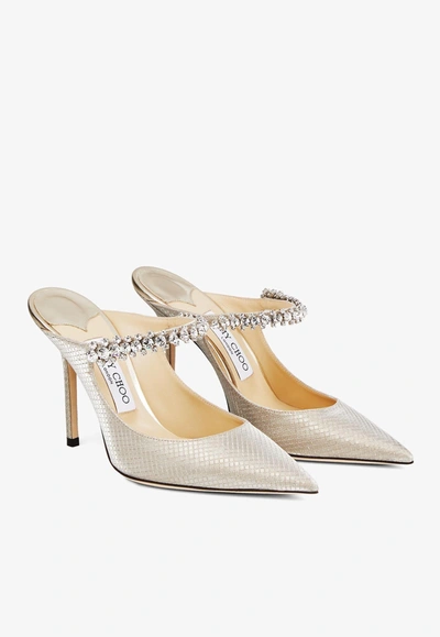 Shop Jimmy Choo Bing 100 Crystal-embellished Mules In Glitter Fabric In Champagne