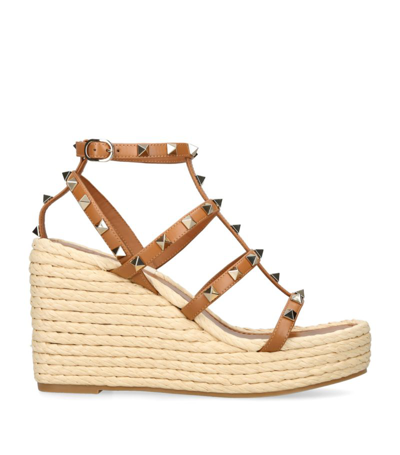 Shop Valentino Leather Rockstud Wedge Sandals 95 In Brown