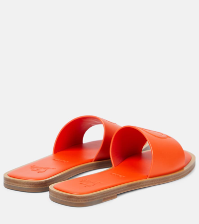 Christian Louboutin Cl Embossed Leather Mules In Orange