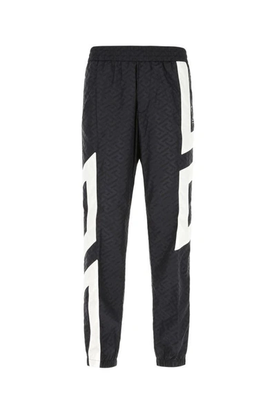 Shop Versace Man Printed Nylon Joggers In Multicolor