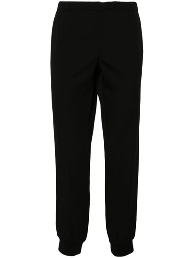 Shop Prada Drawstring-waist Tapered Trousers In Nero