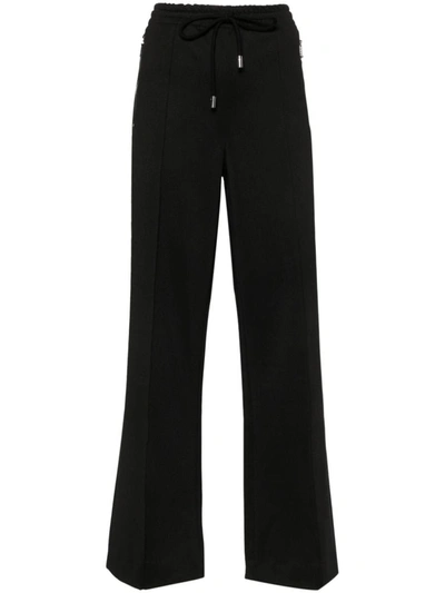 Shop Jw Anderson J.w. Anderson Bootcut Track Pants In Black