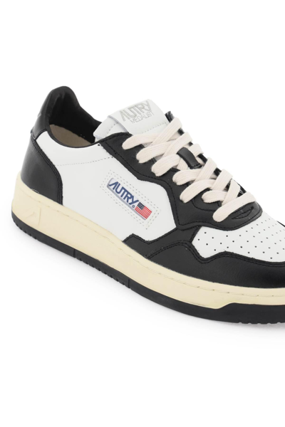 Shop Autry Medalist Low Sneakers In White,black