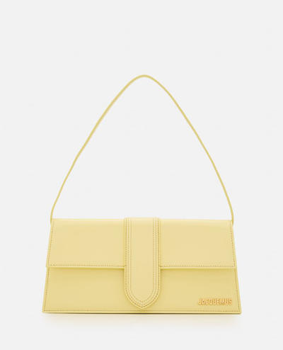 Shop Jacquemus Le Bambino Long Leather Shoulder Bag In Yellow