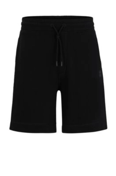 Shop Hugo Boss Cotton-terry Regular-fit Shorts With Logo Badge In Black