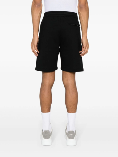 Shop Alexander Mcqueen Shorts Con Logo Distorto In Black