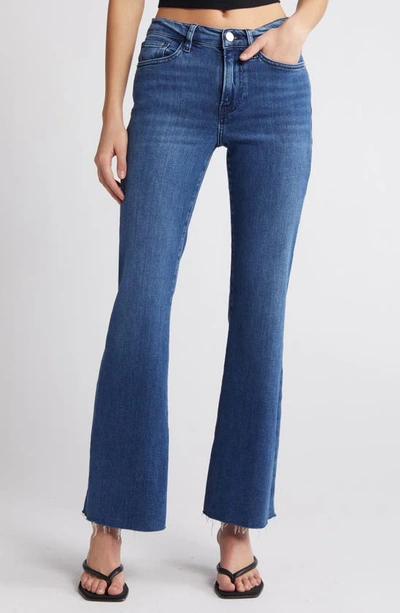 Shop Frame Le Easy Raw Hem Flare Jeans In Temple