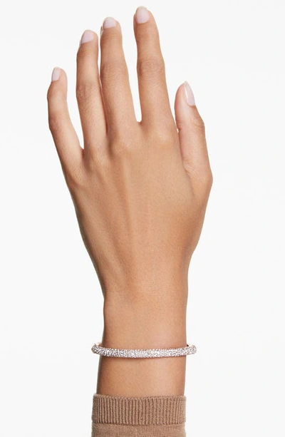 Shop Swarovski Meteora Hinge Bangle In Rose Gold