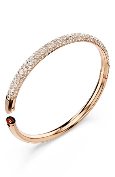 Shop Swarovski Meteora Hinge Bangle In Rose Gold