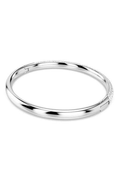 Shop Swarovski Meteora Hinge Bangle In Silver