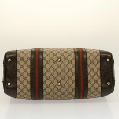 Shop Gucci Gg Canvas Beige Canvas Travel Bag ()