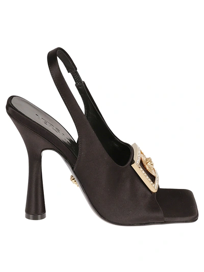 Shop Versace Logo Sole Embellished Buckle Sandals In Black/gold