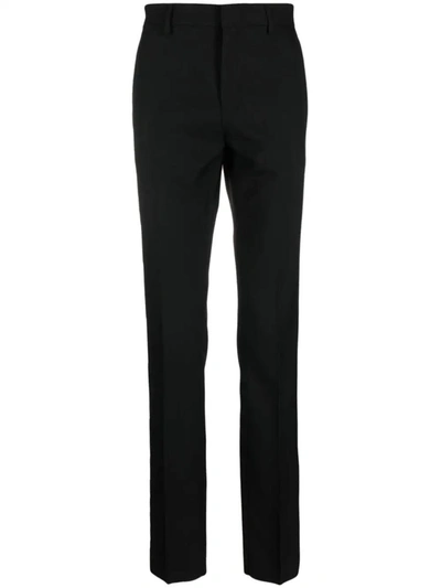 Shop Versace Slim Trousers In Black
